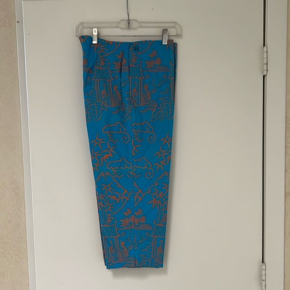 Turquoise capris with orange embroidery